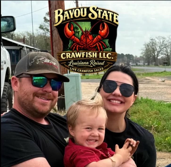 Bayou State Crawfish family in front of their sign